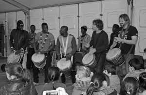 Daniel Verbaan with Babara Bangoura, Ibou Niang, Ousmane Seye, Bouba, Amara and Eef Bresser at the refugee centre in Veldhoven